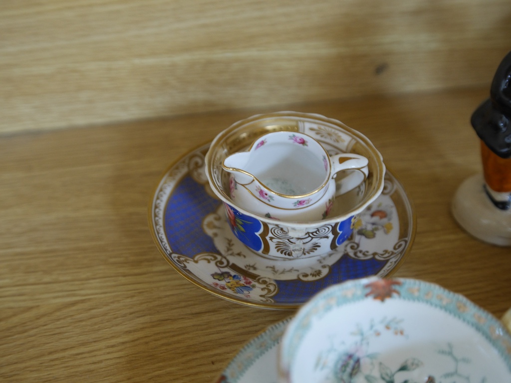 An English part teaset, c.1825 and six Royal Crown Derby coffee cans and saucers etc. Condition - some items cracked chipped and losses to gilding, teapot cover finial broken